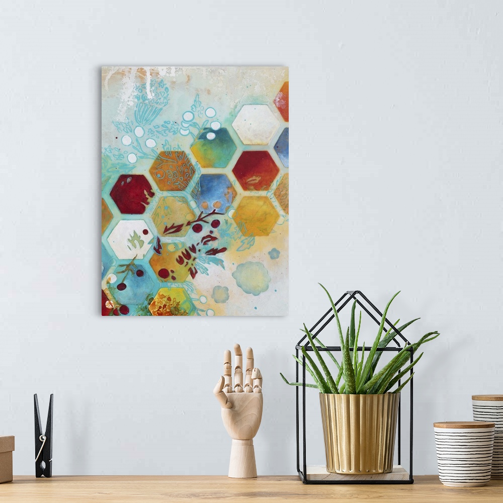 A bohemian room featuring Abstract artwork in shades of turquoise and orange with a geometric hexagon pattern and floral el...