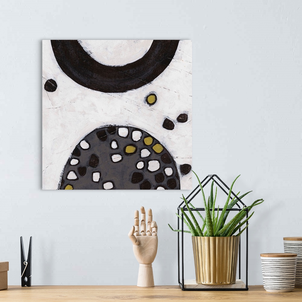 A bohemian room featuring Contemporary mid-century inspired abstract artwork.