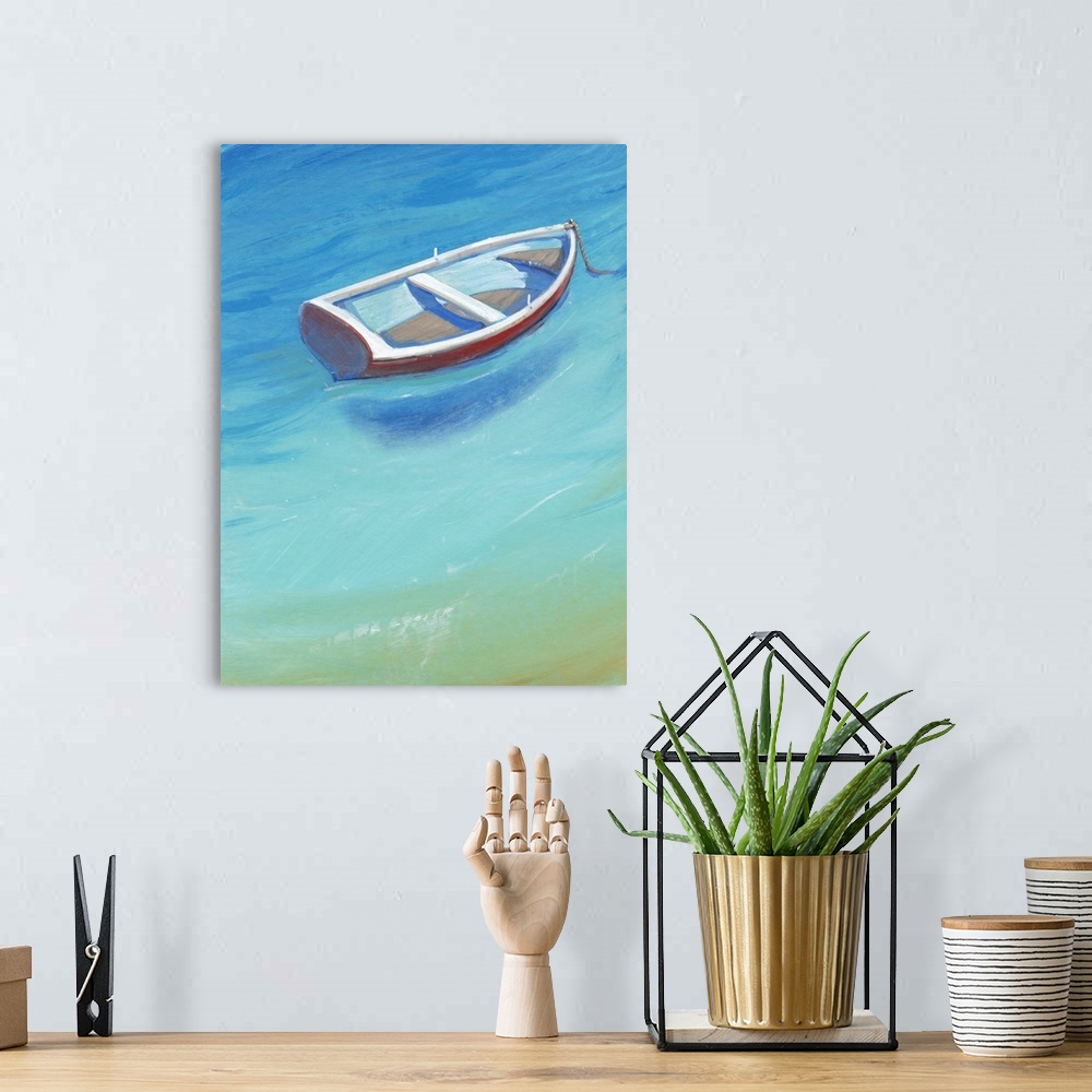 A bohemian room featuring A quaint, little white and red boat anchored in brilliant, calm blue water.