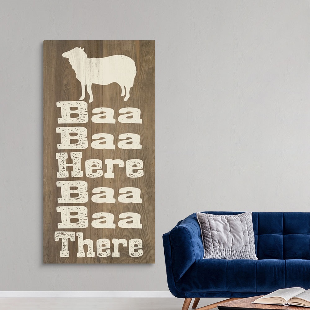 A modern room featuring "Baa Baa Here Baa Baa There" written on a wooden background with a sheep silhouette at the top.