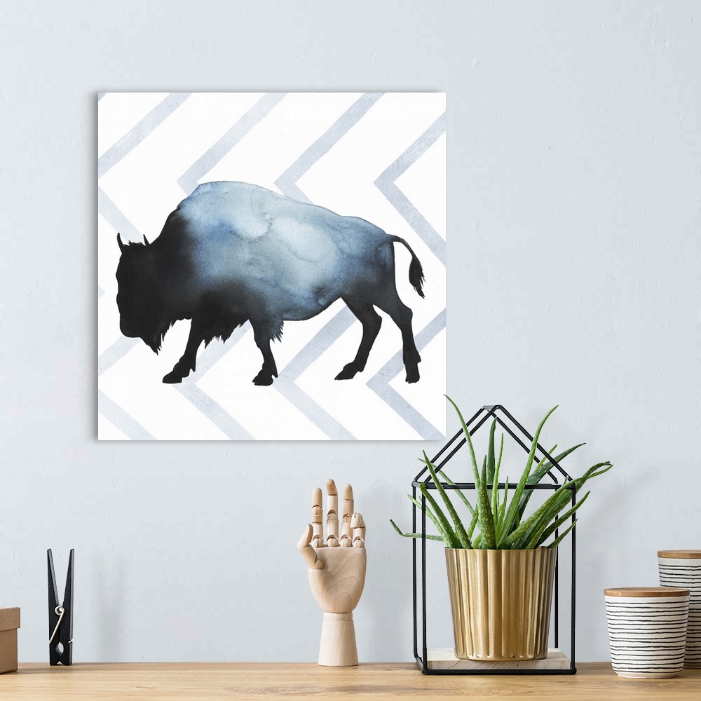 A bohemian room featuring Watercolor bison silhouette on a grey geometric background.