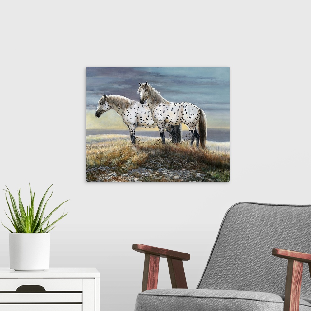 A modern room featuring Contemporary painting of two spotted horses standing on a countryside hill.