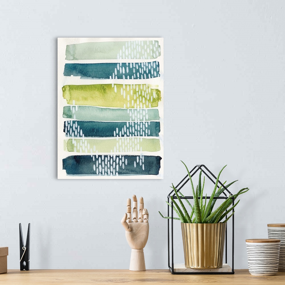 A bohemian room featuring Watercolor abstract painting in blue and green shades, with white patterns.