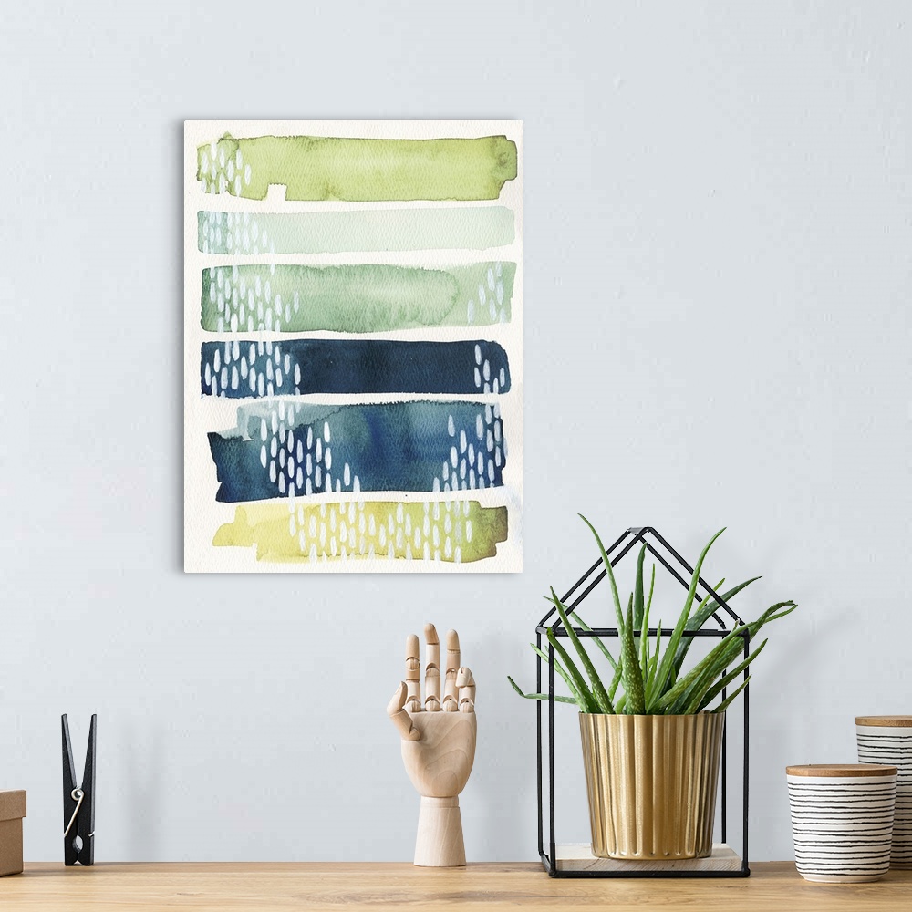 A bohemian room featuring Watercolor abstract painting in blue and green shades, with white patterns.