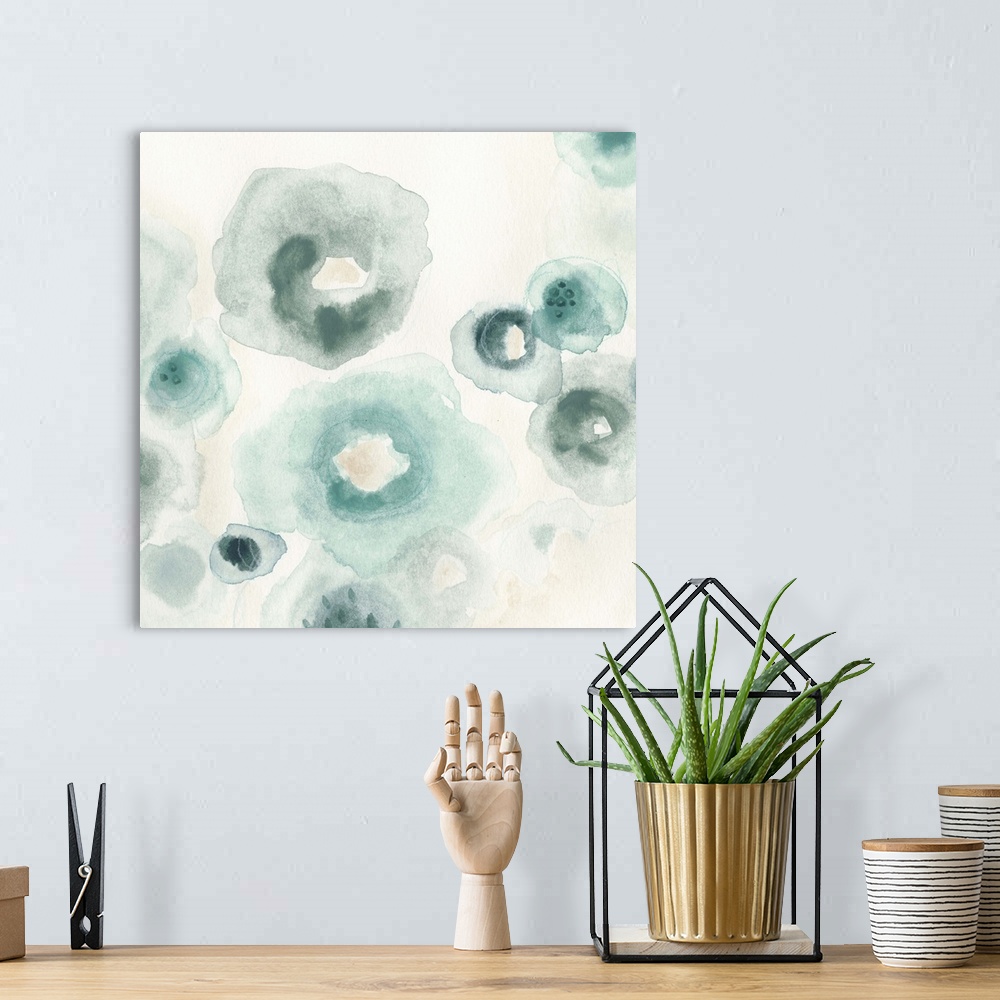 A bohemian room featuring Abstract watercolor floral painting in pale blue and grey.