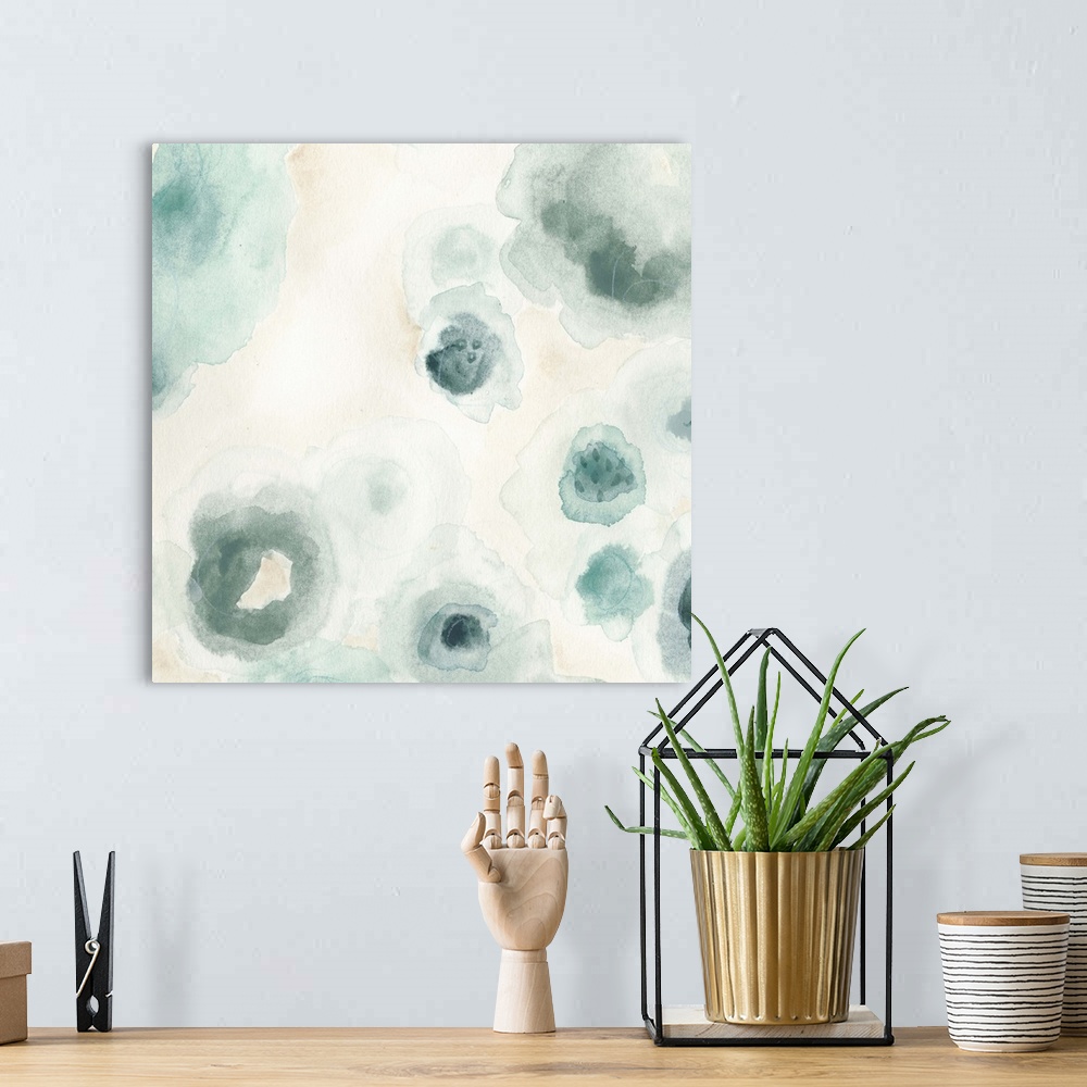 A bohemian room featuring Abstract watercolor floral painting in pale blue and grey.
