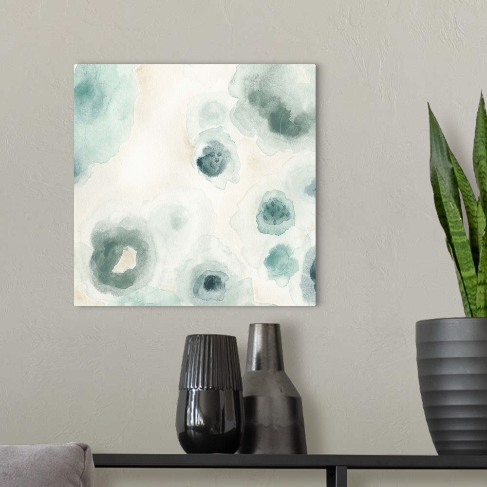 A modern room featuring Abstract watercolor floral painting in pale blue and grey.