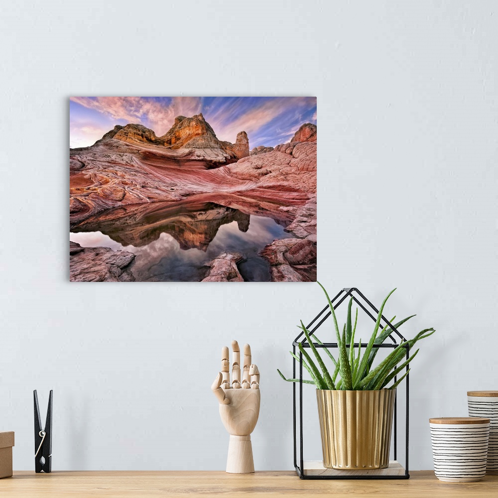 A bohemian room featuring Rock formations in the Arizona desert under a sky in pink and blue sunset light.