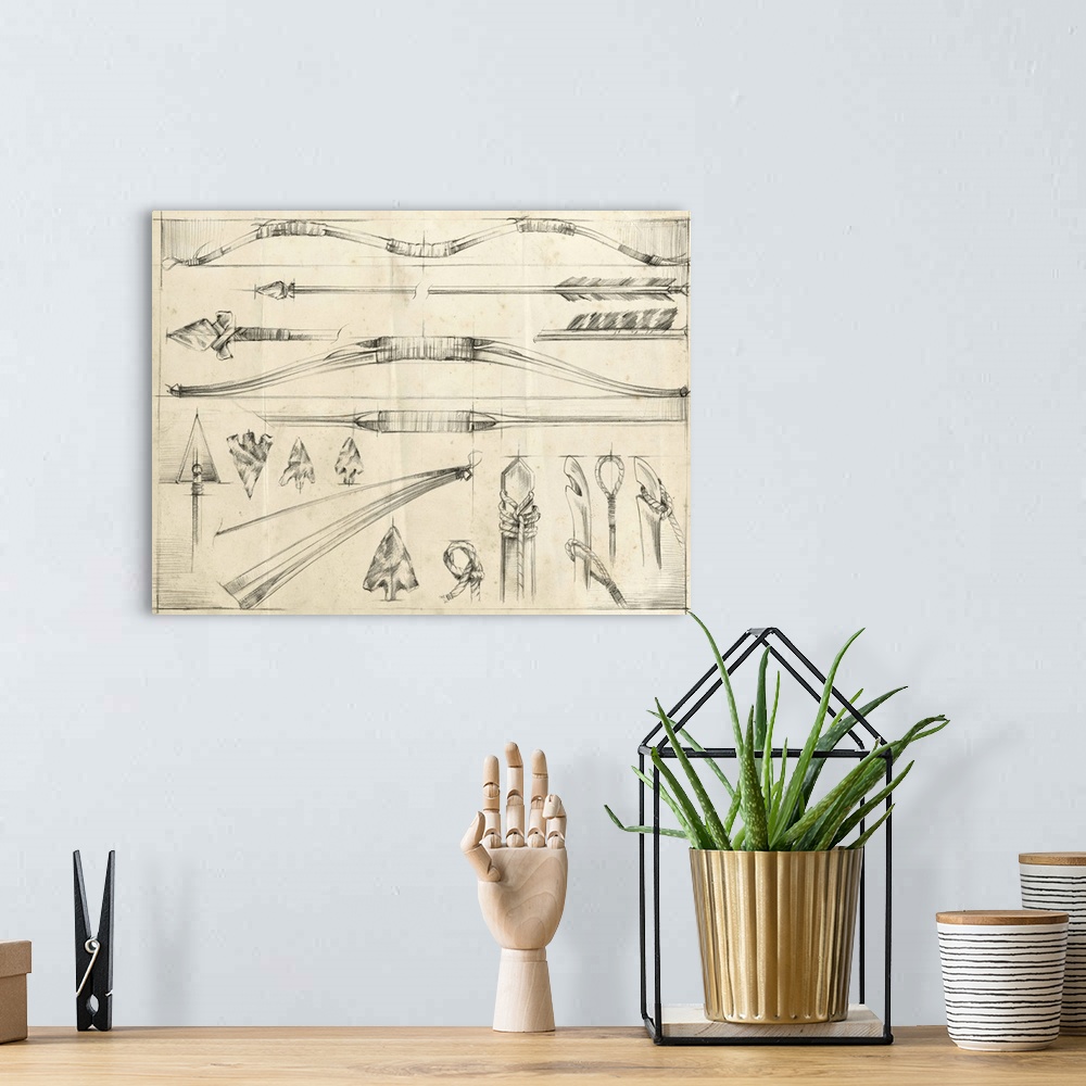A bohemian room featuring Detailed pencil illustration of several arrows, bows, and arrowheads.