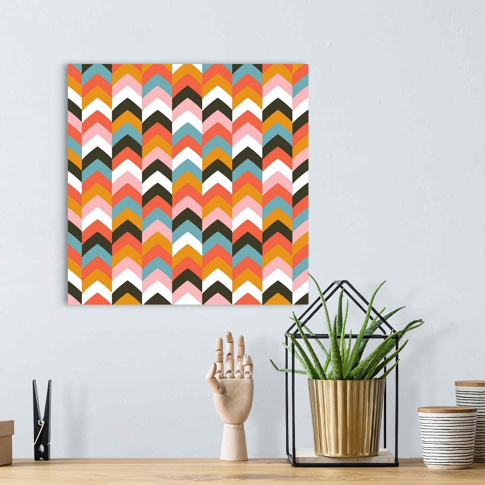 A bohemian room featuring Geometric artwork made from a chevron pattern.