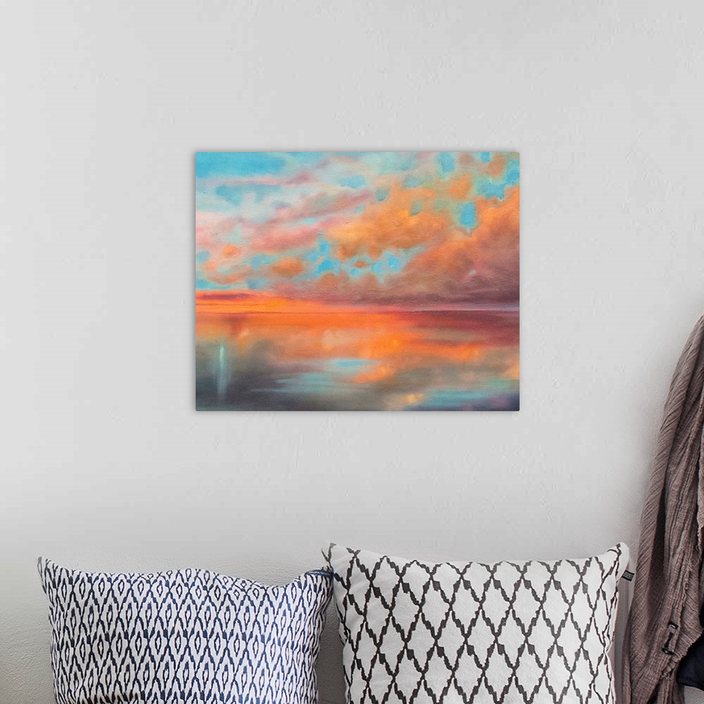 A bohemian room featuring Contemporary artwork of a stunning sunset with orange clouds against a turquoise sky over the ocean.