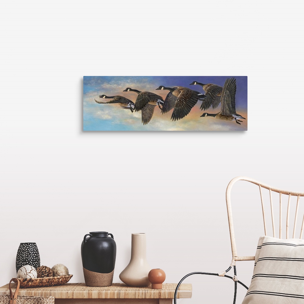 A farmhouse room featuring Contemporary painting of geese in mid flight.