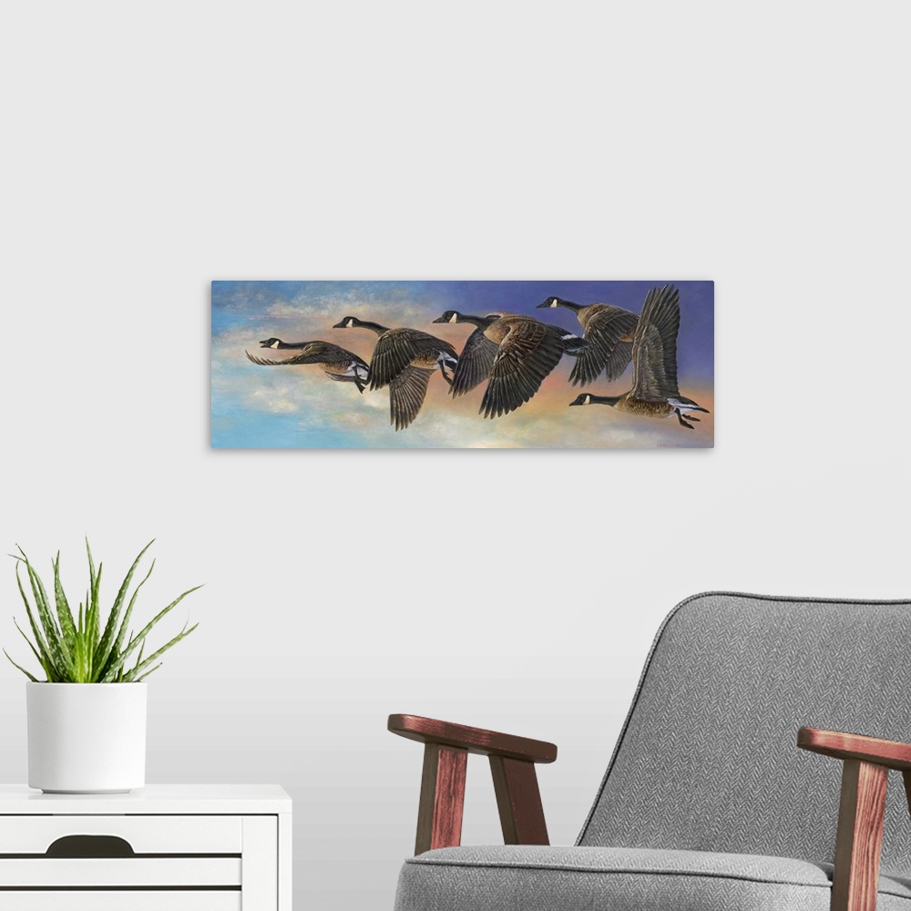 A modern room featuring Contemporary painting of geese in mid flight.