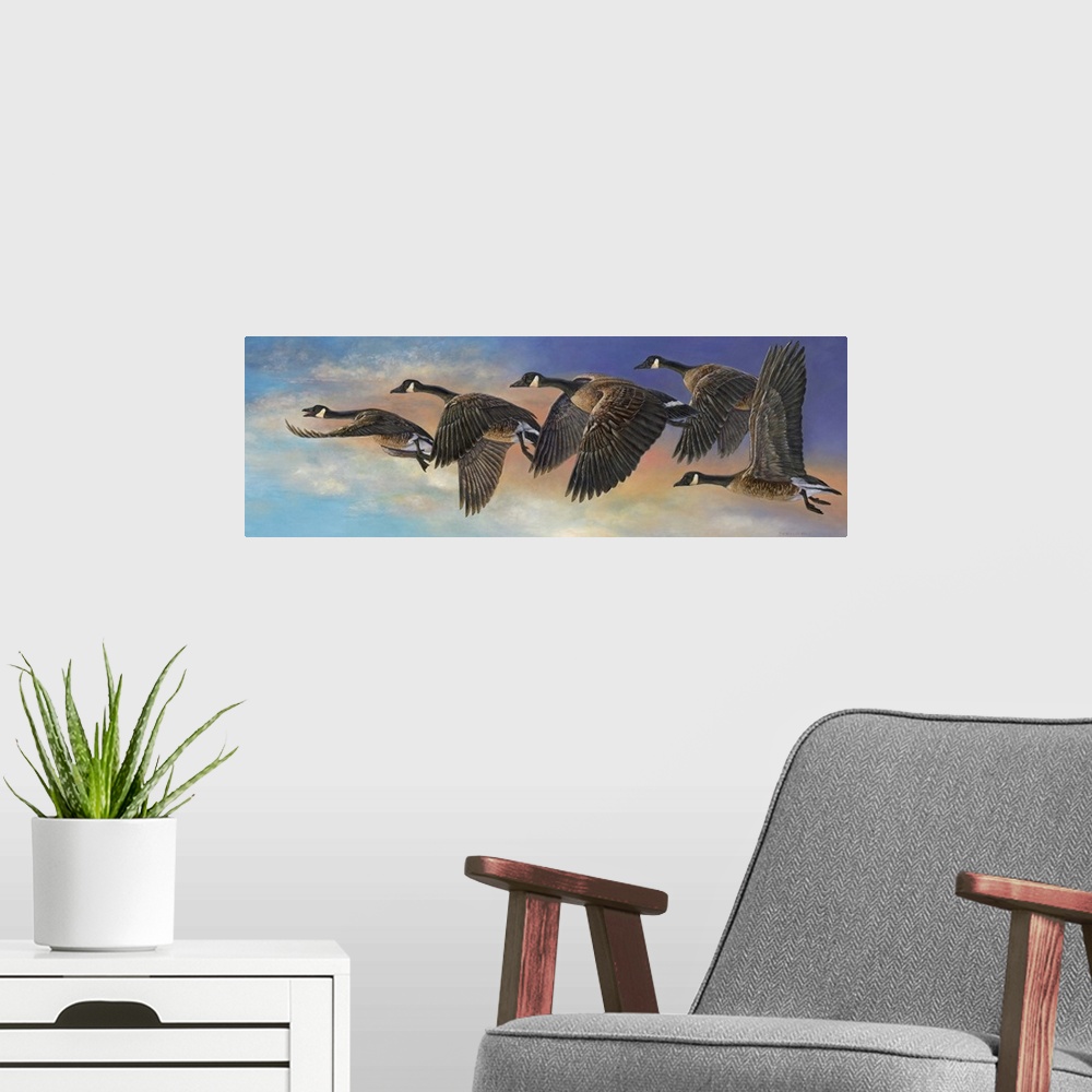 A modern room featuring Contemporary painting of geese in mid flight.