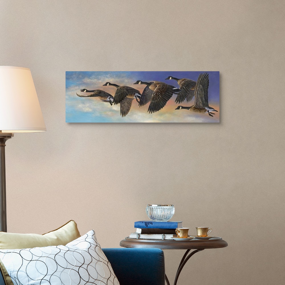 A traditional room featuring Contemporary painting of geese in mid flight.