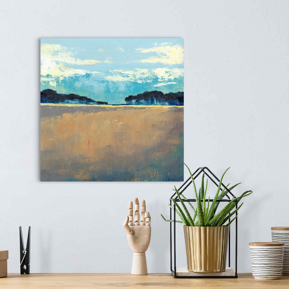 A bohemian room featuring Contemporary painting of landscape with dark trees in the flat landscape under a blue sky.