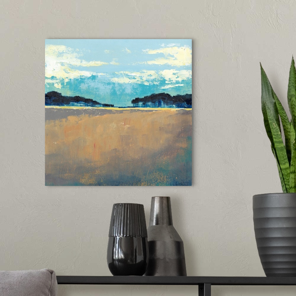 A modern room featuring Contemporary painting of landscape with dark trees in the flat landscape under a blue sky.