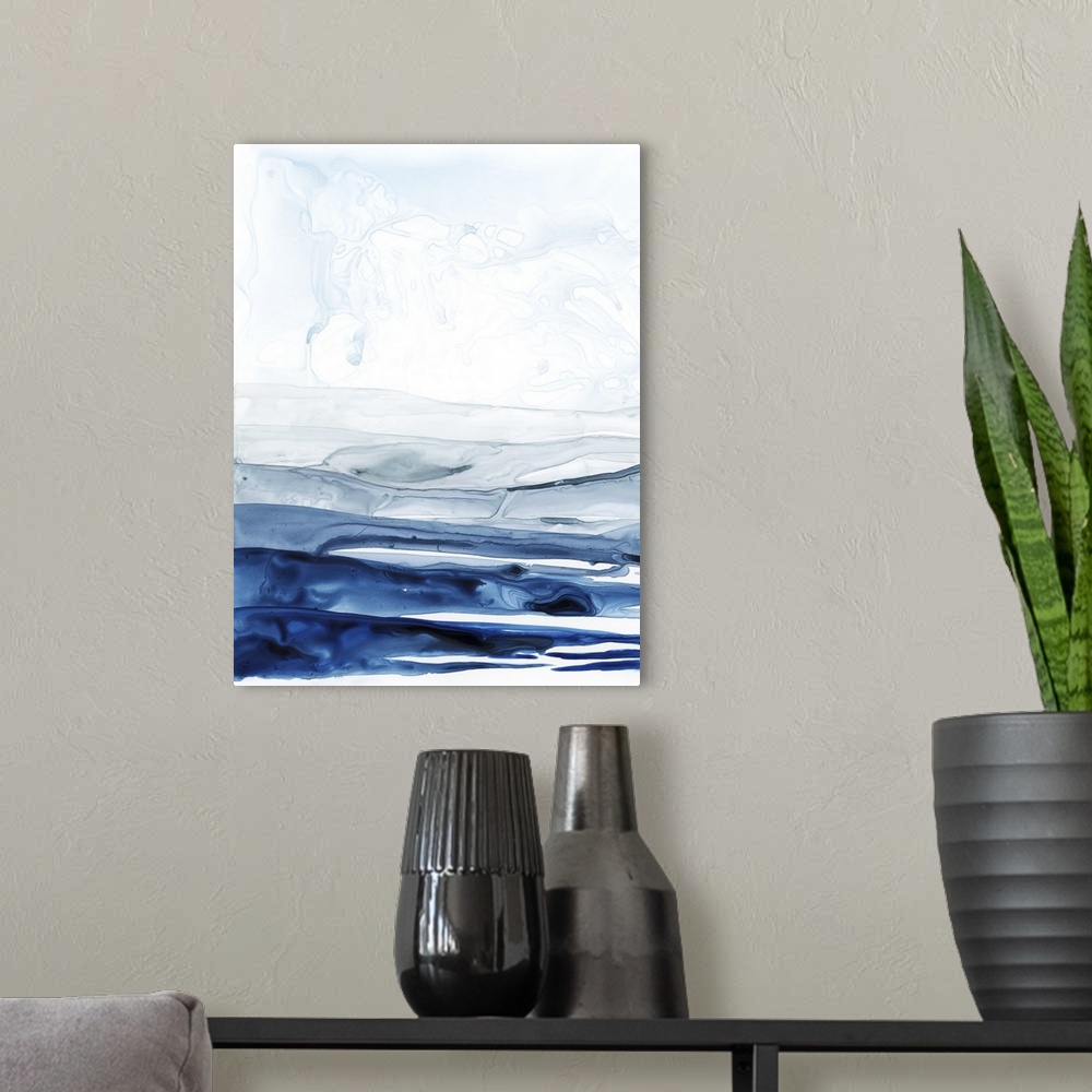 A modern room featuring Abstract contemporary painting resembling a deep blue ocean under a pale white sky.
