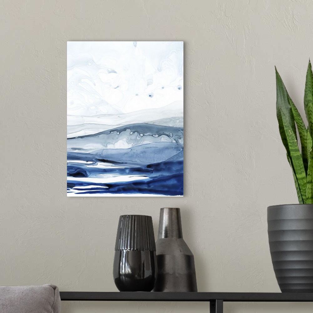 A modern room featuring Abstract contemporary painting resembling a deep blue ocean under a pale white sky.