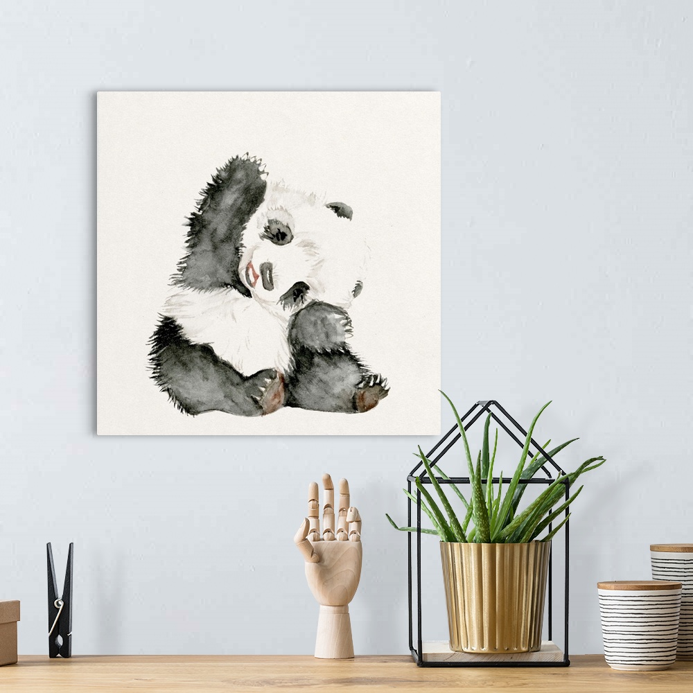 A bohemian room featuring Watercolor artwork of a cute baby panda waving.