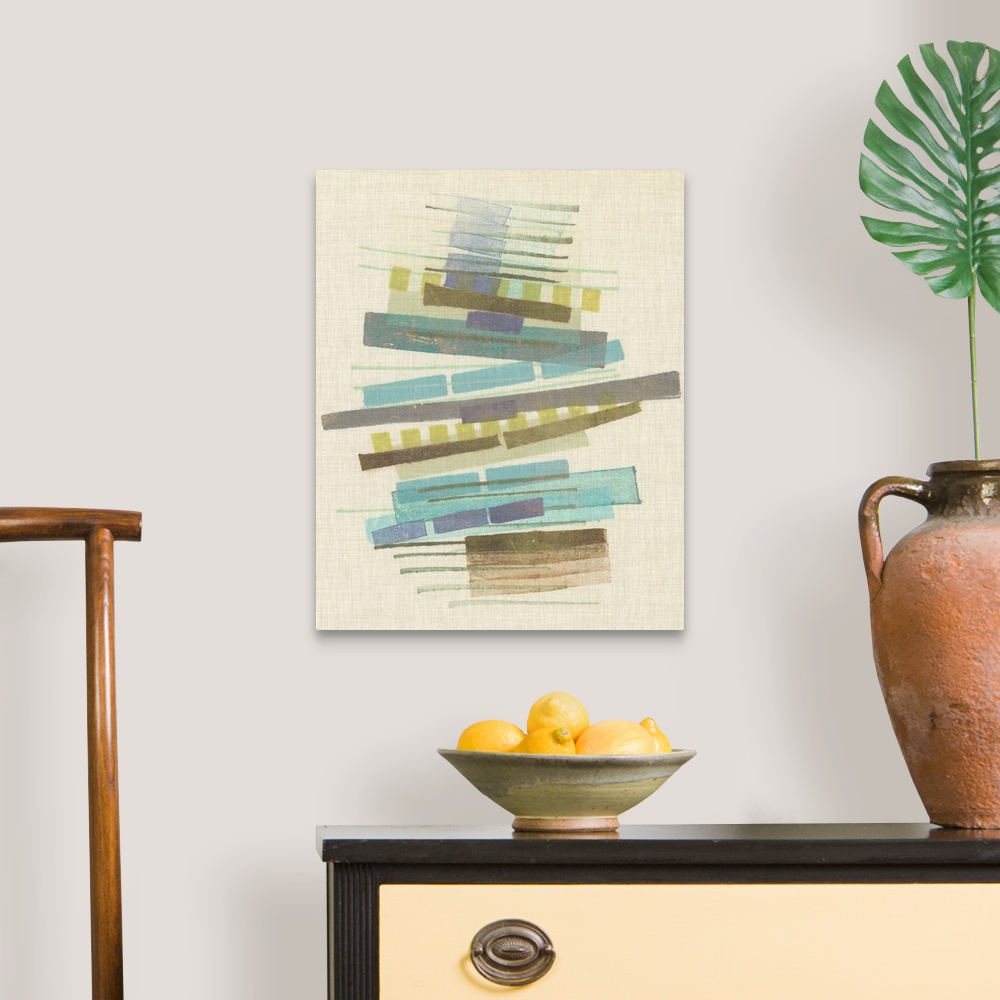 A traditional room featuring Mid-century inspired abstract artwork using muted colors in stacked rectangular shapes.