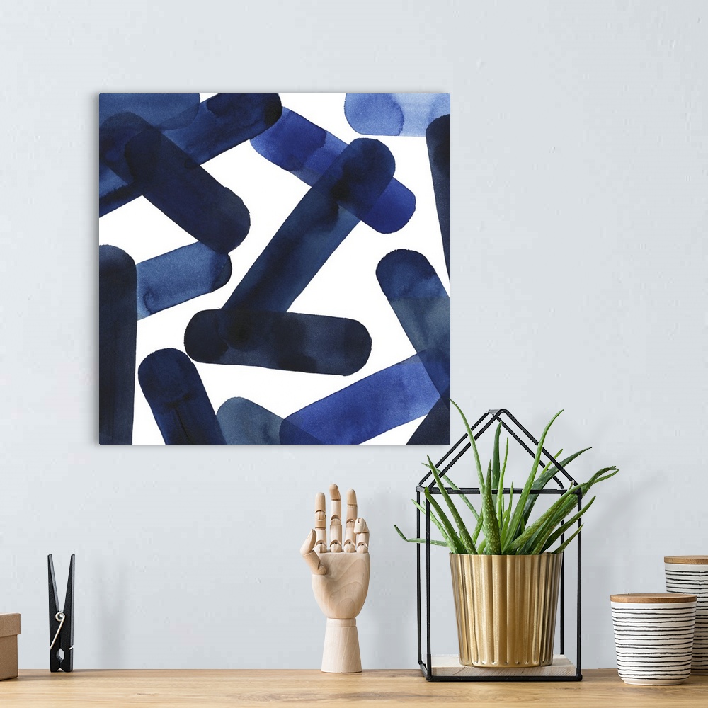 A bohemian room featuring Square abstract of blue elongated shapes falling over a white background.