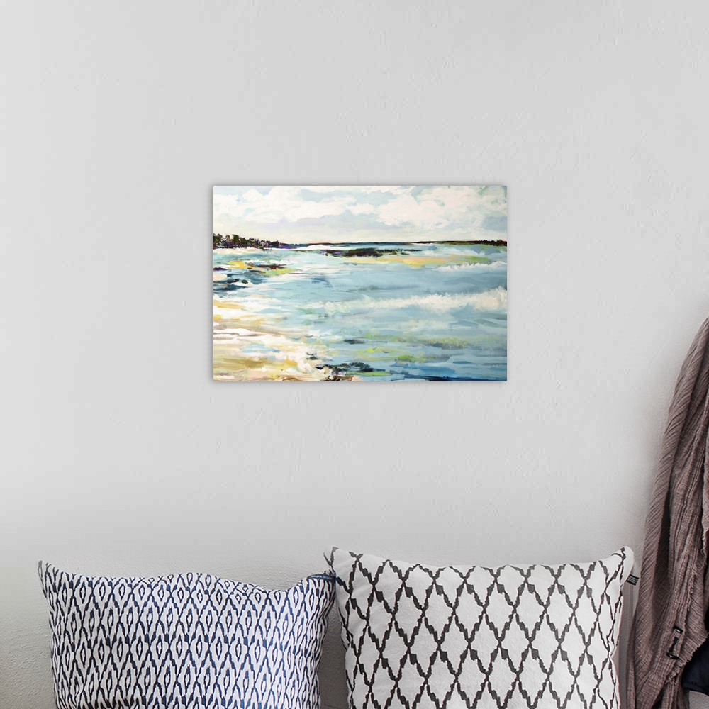 A bohemian room featuring Contemporary artwork of waves of ocean water on a sandy beach.