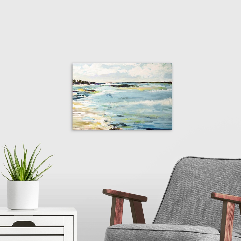 A modern room featuring Contemporary artwork of waves of ocean water on a sandy beach.