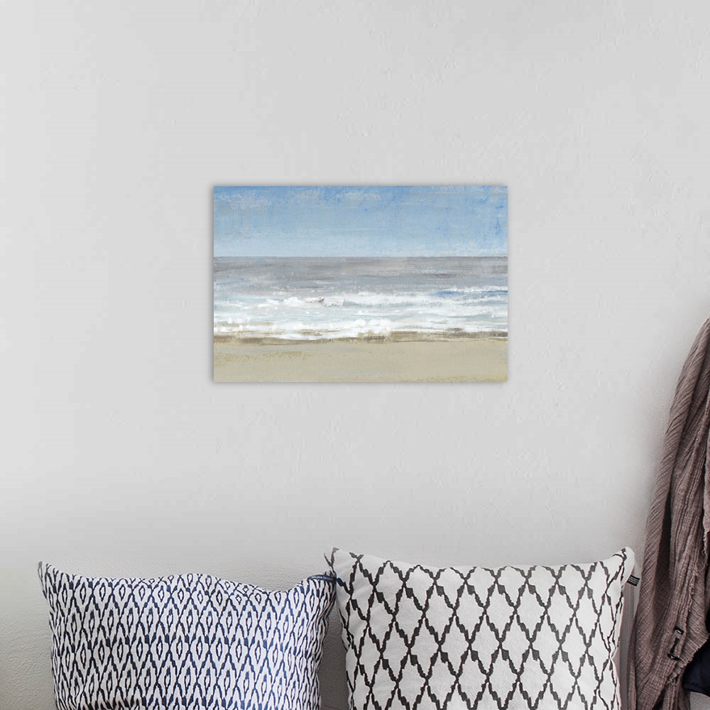 A bohemian room featuring Modern seascape painting of waves on a sandy beach.