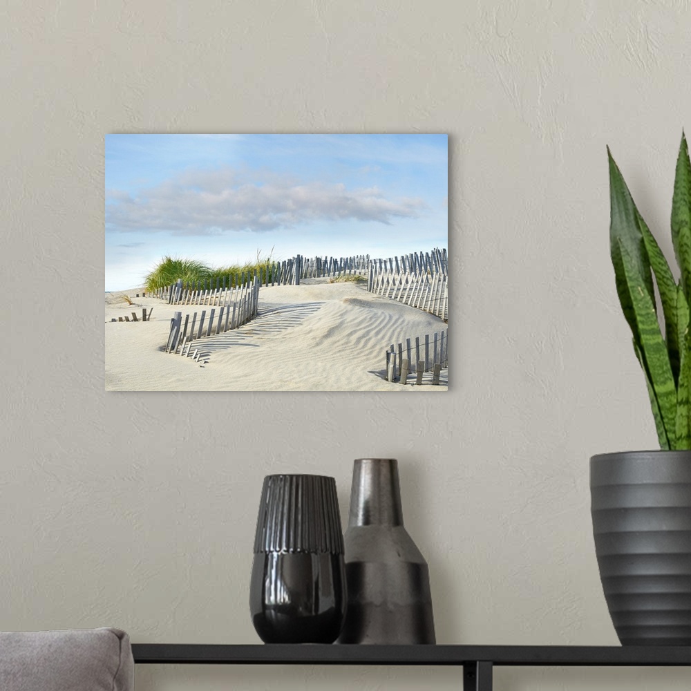 A modern room featuring Photograph with leading lines following the wooden fence on the sand dunes at the beach.