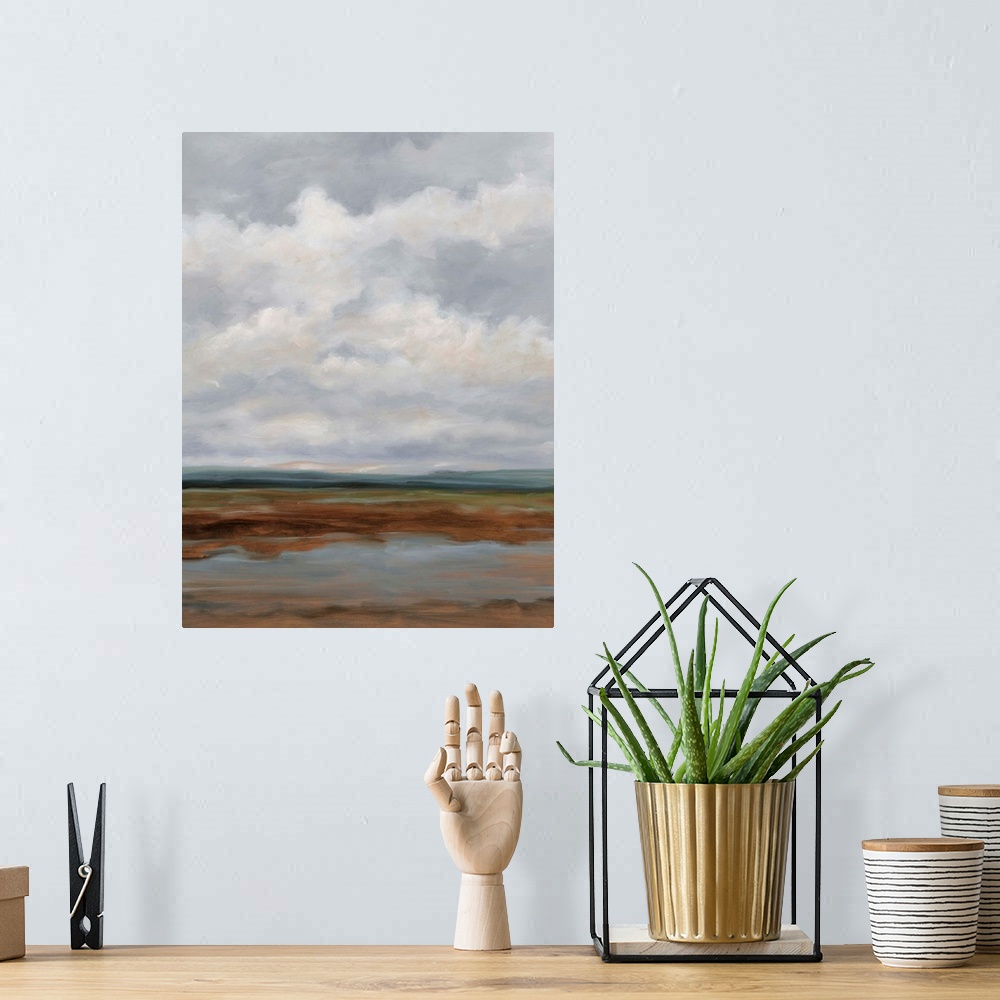 A bohemian room featuring Contemporary landscape painting with a sky filled with clouds.