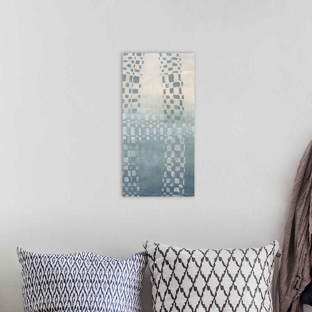 A bohemian room featuring Abstract painting of cascading geometric shapes in a muted blue against a split tone cream and bl...