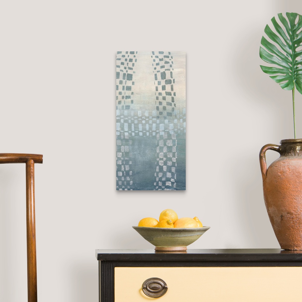 A traditional room featuring Abstract painting of cascading geometric shapes in a muted blue against a split tone cream and bl...