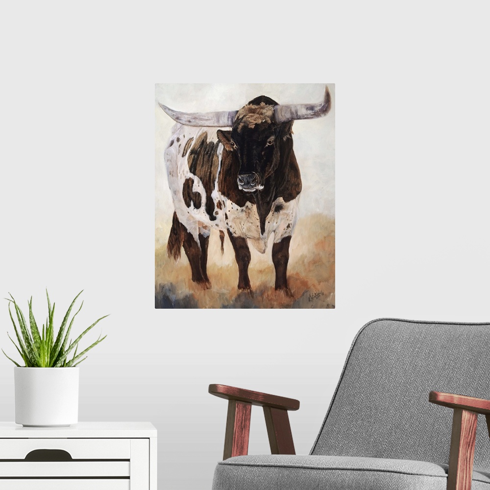 A modern room featuring Horizontal contemporary artwork of a longhorn cow grazing on a field in warm tones.
