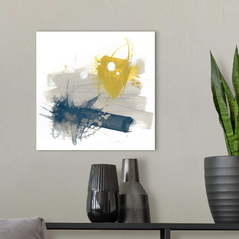 A modern room featuring Abstract art on a square canvas with yellow, grey, and navy blue paint splatters.