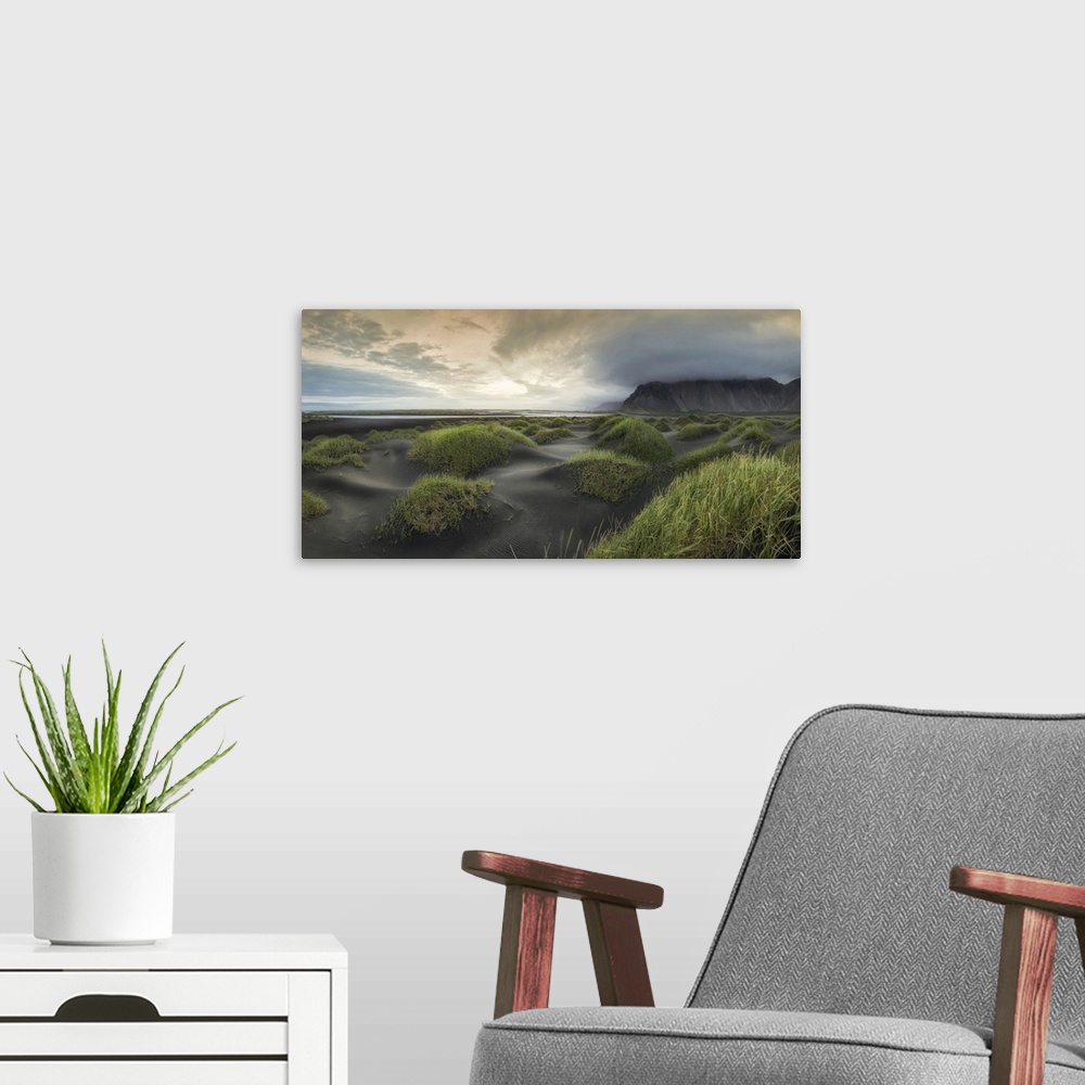 A modern room featuring Stormy clouds gather over tranquil dunes in this beach landscape photograph.