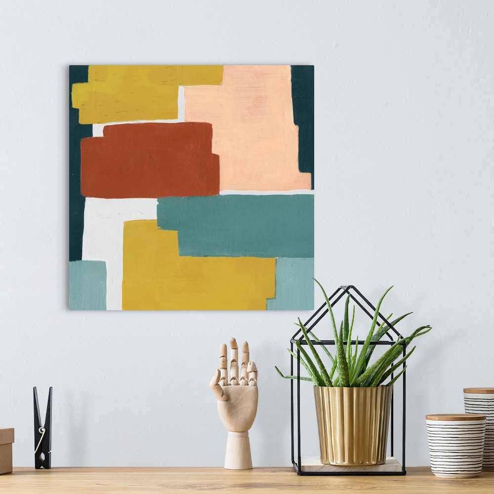 A bohemian room featuring Contemporary artwork featuring blocks of color in shades of orange, yellow and blue-green.