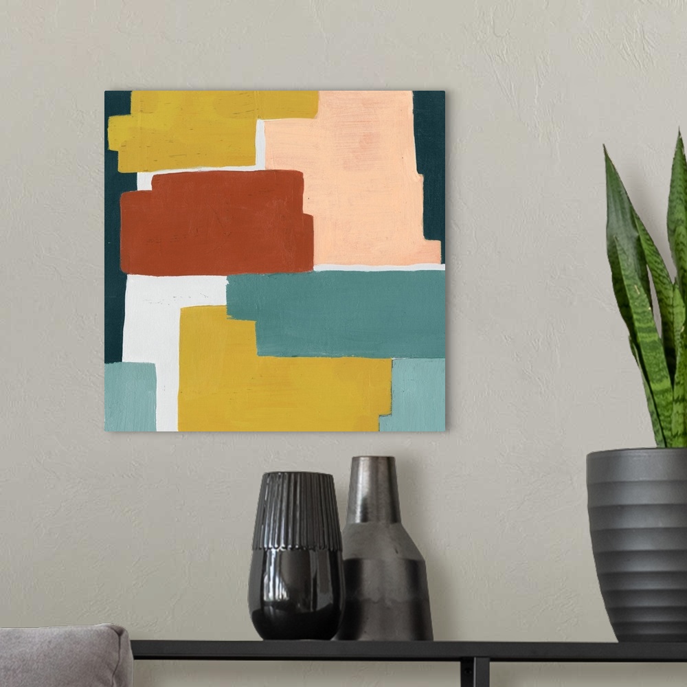 A modern room featuring Contemporary artwork featuring blocks of color in shades of orange, yellow and blue-green.