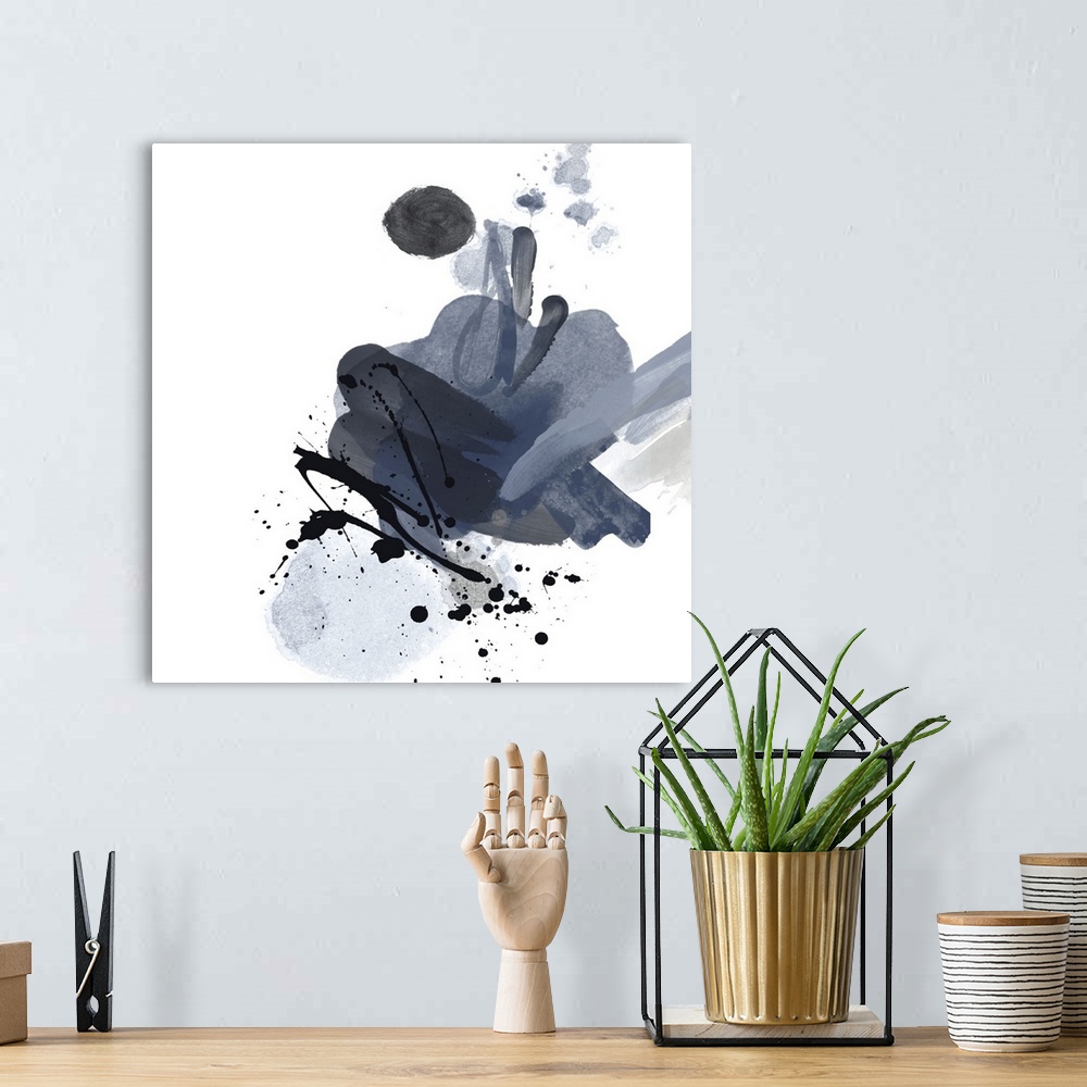 A bohemian room featuring This expressive abstract painting features black paint splatters over broad brush strokes in shad...