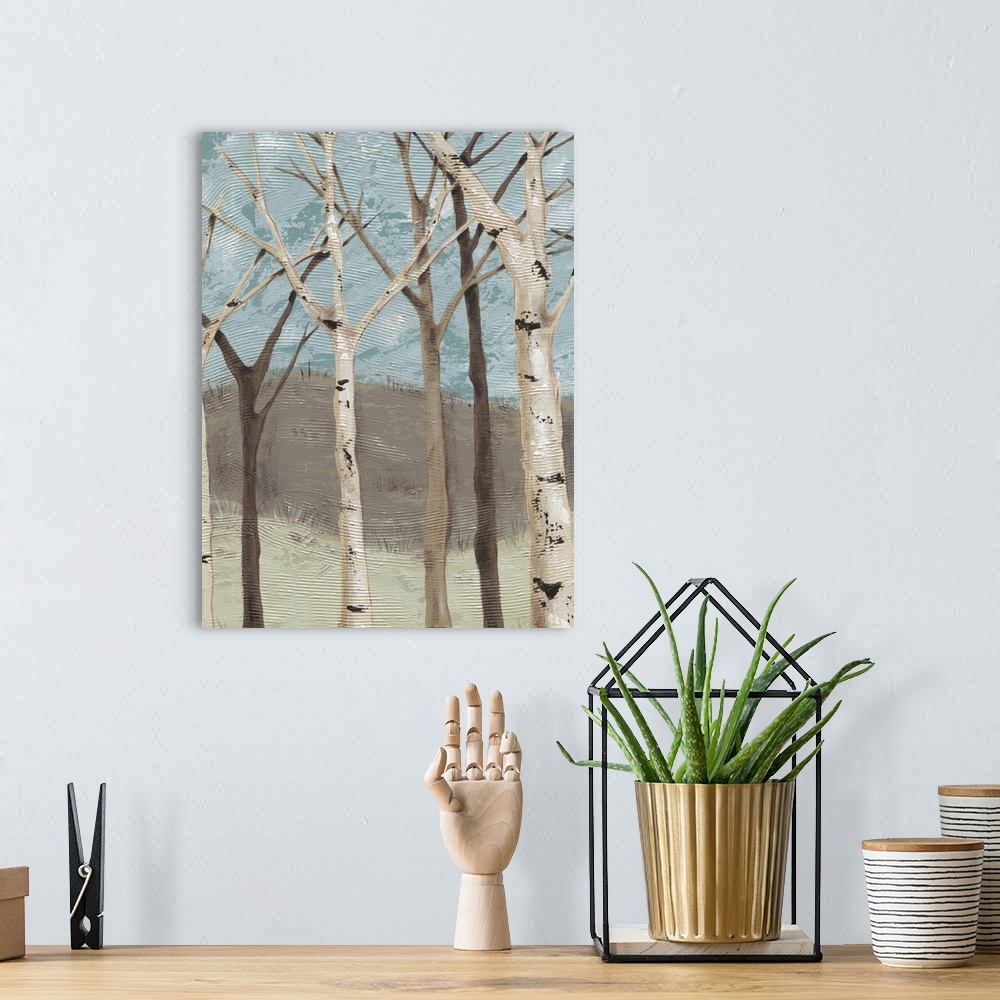 A bohemian room featuring Contemporary painting of bare branched birch trees against a blue and brown background.