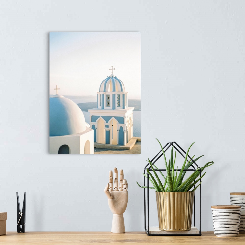 A bohemian room featuring Photograph of simple church buildings with blue domed roofs, Santorini, Greece.