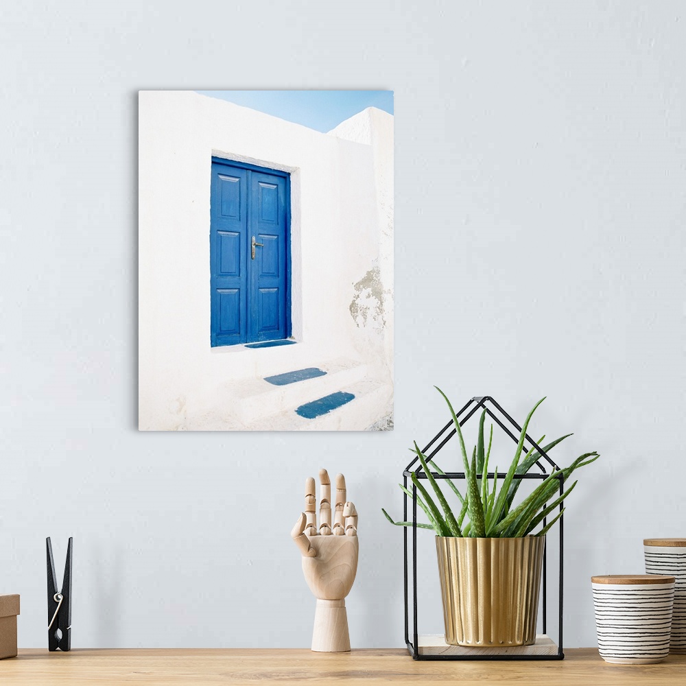 A bohemian room featuring Photograph of a pair of doors and steps painted in the iconic shade of blue that Santorini, Greec...