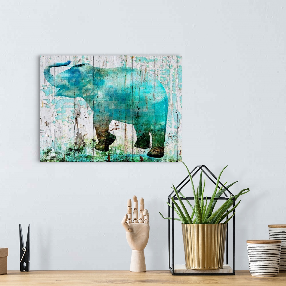 A bohemian room featuring Decorative art featuring a blue silhouette of an elephant over wood boards that are cracking and ...