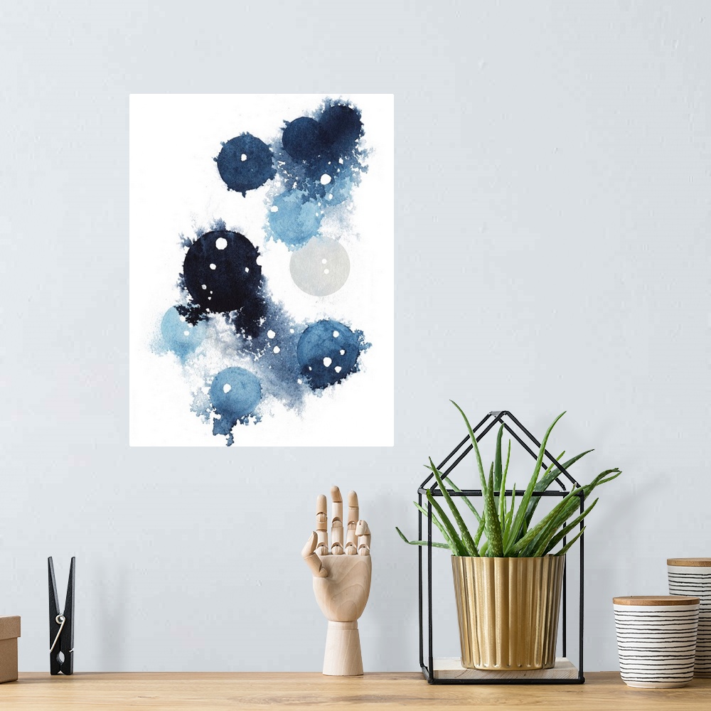 A bohemian room featuring Contemporary abstract artwork of blue globular shapes with bleed stretching out into empty space.