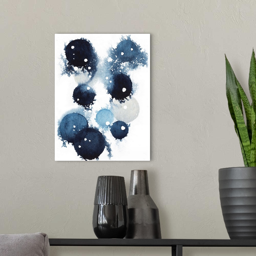 A modern room featuring Contemporary abstract artwork of blue globular shapes with bleed stretching out into empty space.