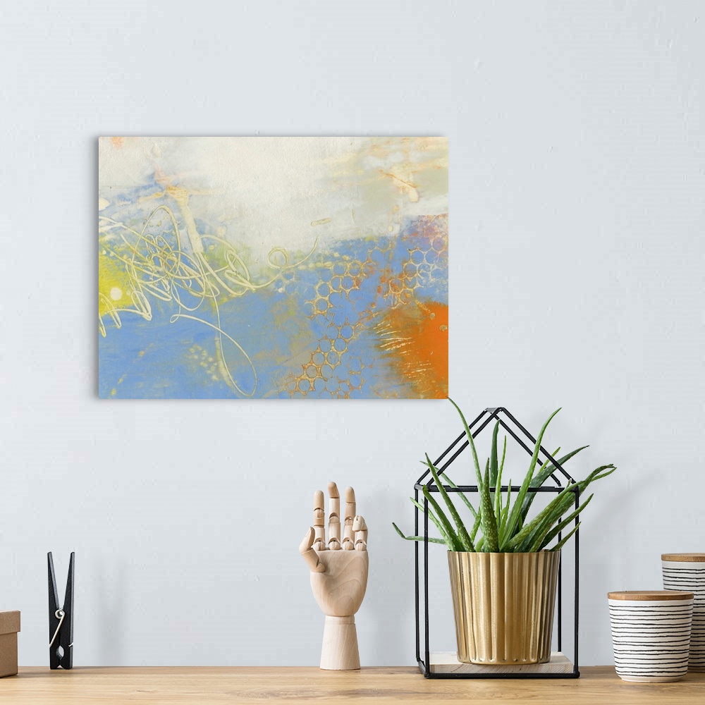 A bohemian room featuring Abstract contemporary artwork in cheerful shades of yellow and blue.