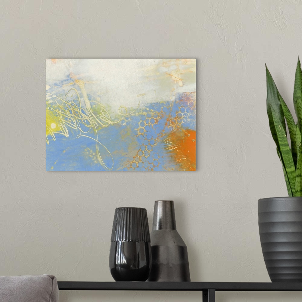 A modern room featuring Abstract contemporary artwork in cheerful shades of yellow and blue.