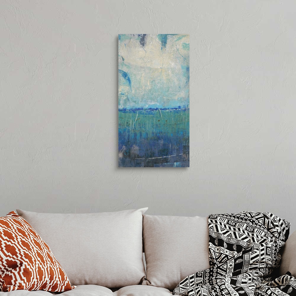 A bohemian room featuring Contemporary abstract artwork resembling a coastal landscape.