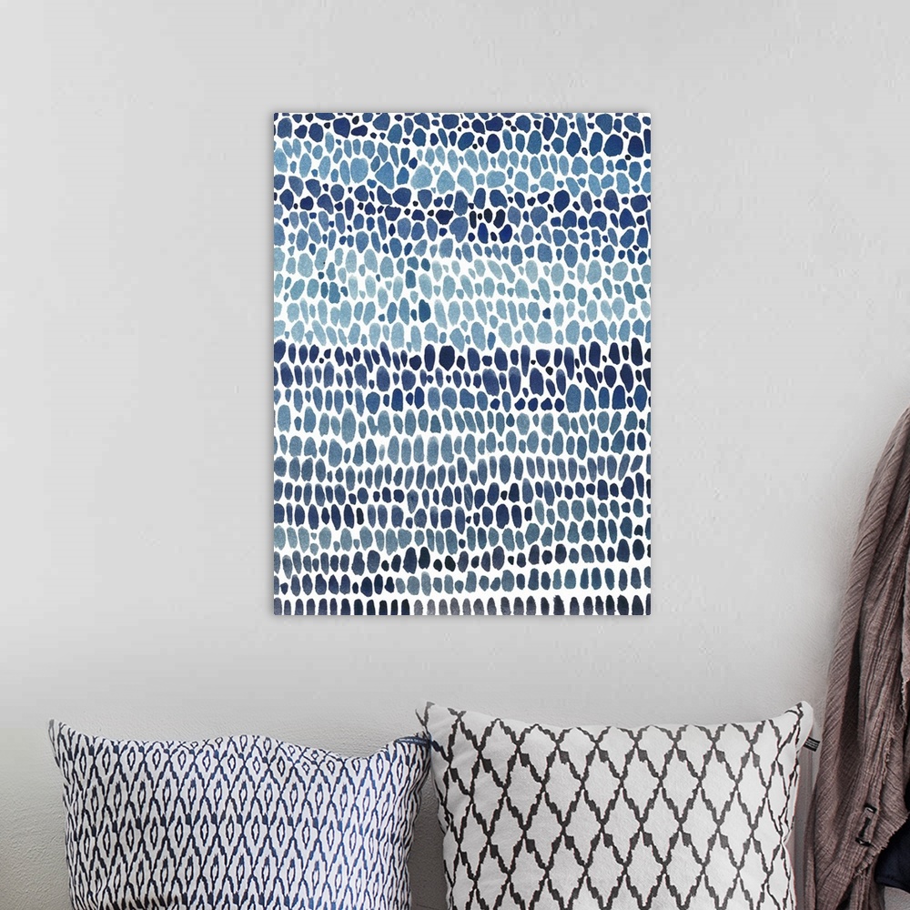 A bohemian room featuring Irregular circular shapes in rows filling up the canvas in shades of blue.