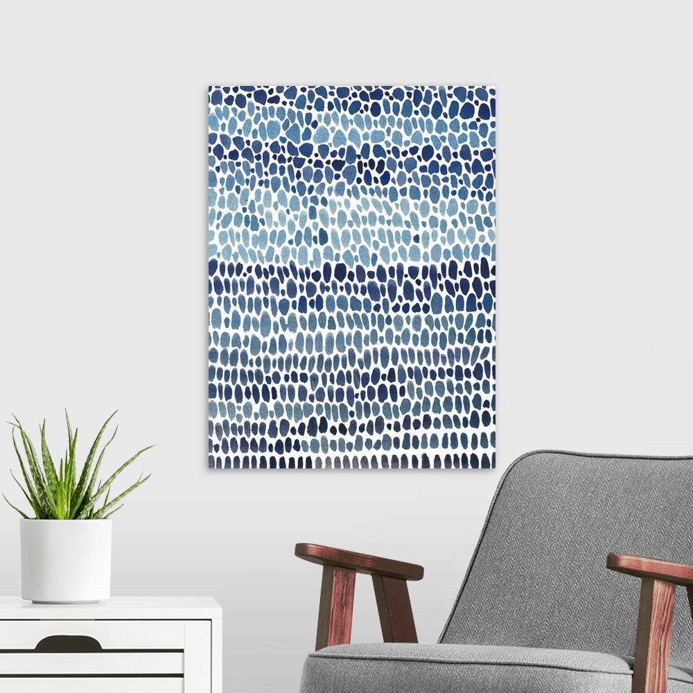 A modern room featuring Irregular circular shapes in rows filling up the canvas in shades of blue.